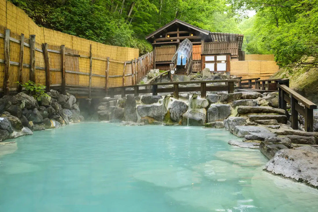 Zao Dai-Rotenburo, a milky-blue sulfur open-air bath in a mountain ravine