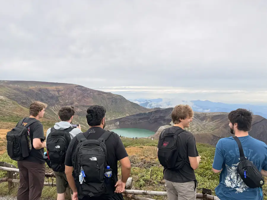 Travelers chatting on the crater rim